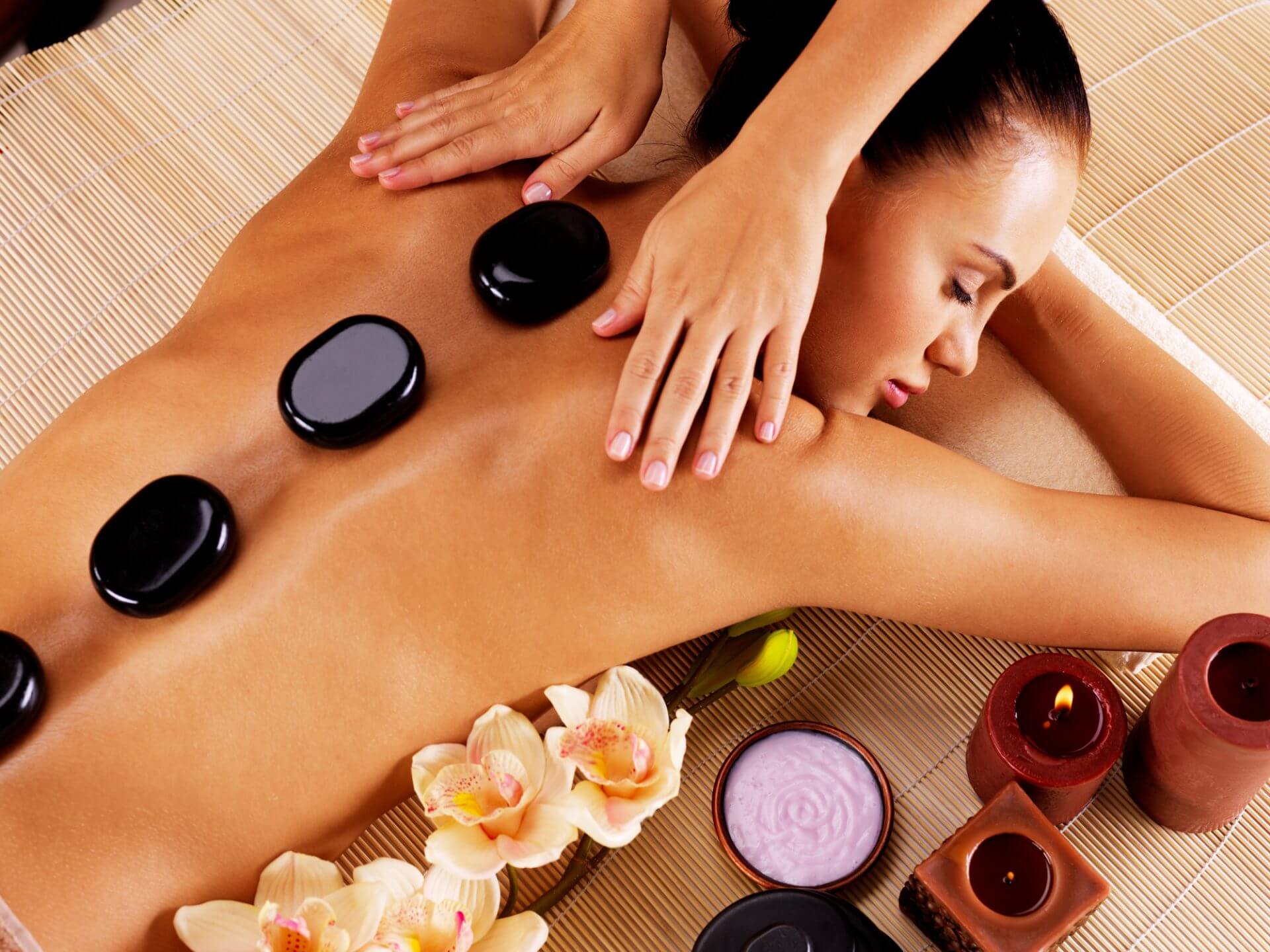 Woman receiving a relaxing hot stone massage