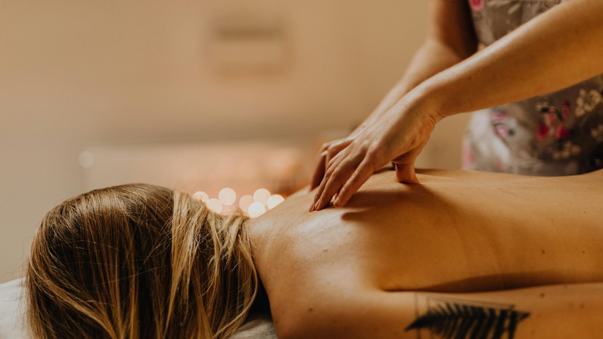 Relaxing massage therapy with hands working on client's back